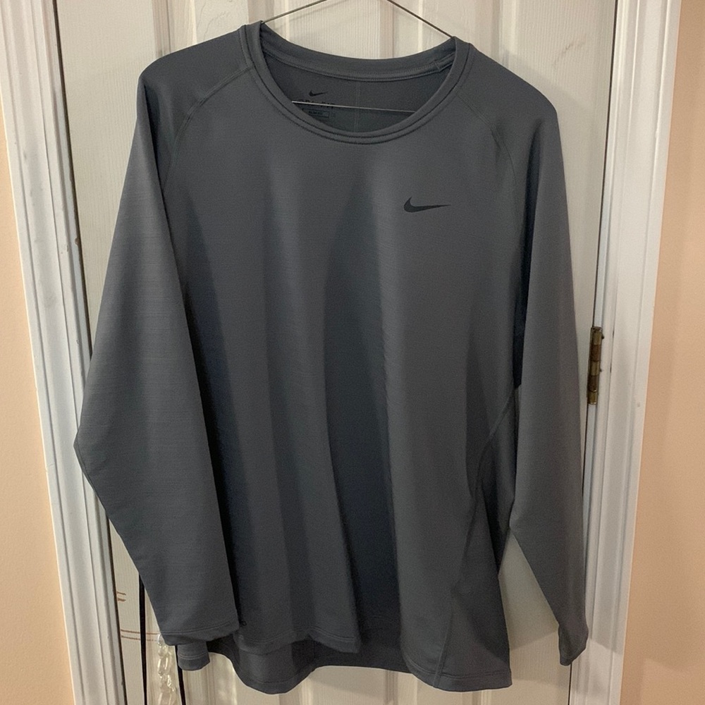 Grey Nike long sleeved insulated shirt.